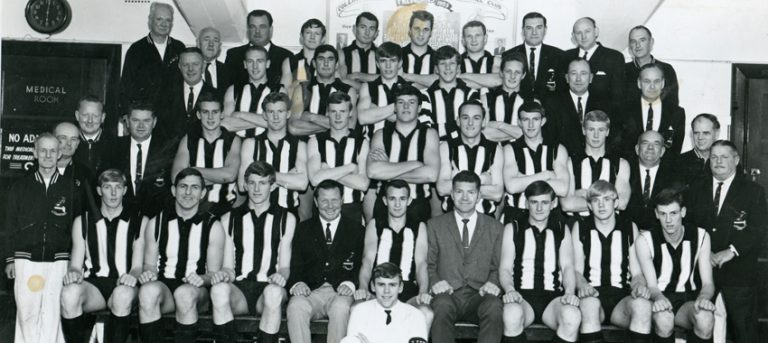 Back row: S Blanch (bootstudder), J Dicker (Committee), G Carrison (Committee), J Thatcher, B Gray, A Chapman, D Dalton, W Skewes (Committee), T Smith (Door steward), K Tate (trainer). Third row: L Bromley (Committee), K Huppatz, D Wright, L Clark, N Vincent, E Burgess, A Pond(Committee), T Pew (Committee). Second row: R Smith (Trainer), L Lees (Head trainer), J Smith (secretary), M Ballantyne, R Sanders, L Adamson, G Jenkin, L Evans, M Pitt, I Bremner, Fr Bruce (Committee), B Lewis (Trainer), G Hudd (Committee). Front row: R Patterson (Property steward), J Burton, P Wadham, L Thompson, J Smith (Chairman), E Hutchesson (Captain), N Mann (Coach), J Mahon, V Ellis, D Searl, J Morrison (Messenger).