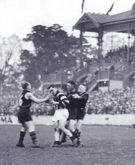 The incident that led to Gordon Coventry's suspension, as Richmond players come in to remonstrate (Reference The Official Collingwood Illustrated Encyclopedia by Michael Roberts and Glenn McFarlane).