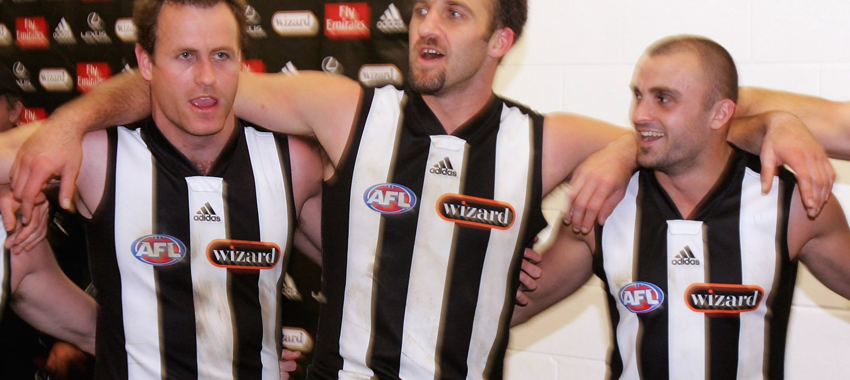 James Clement, Anthony Rocca and Rhyce Shaw sing the team song after winning the round 12 match against Sydney at Telstra Stadium in Sydney, Australia.